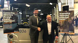 Alberta Transportation Minister Brian Mason and city of Edmonton mayor Don Iveson celebrate Albert Community Transit funding.