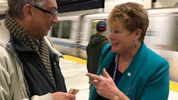 Grace Crunican greeting a BART rider during Transit Week held September 2018.