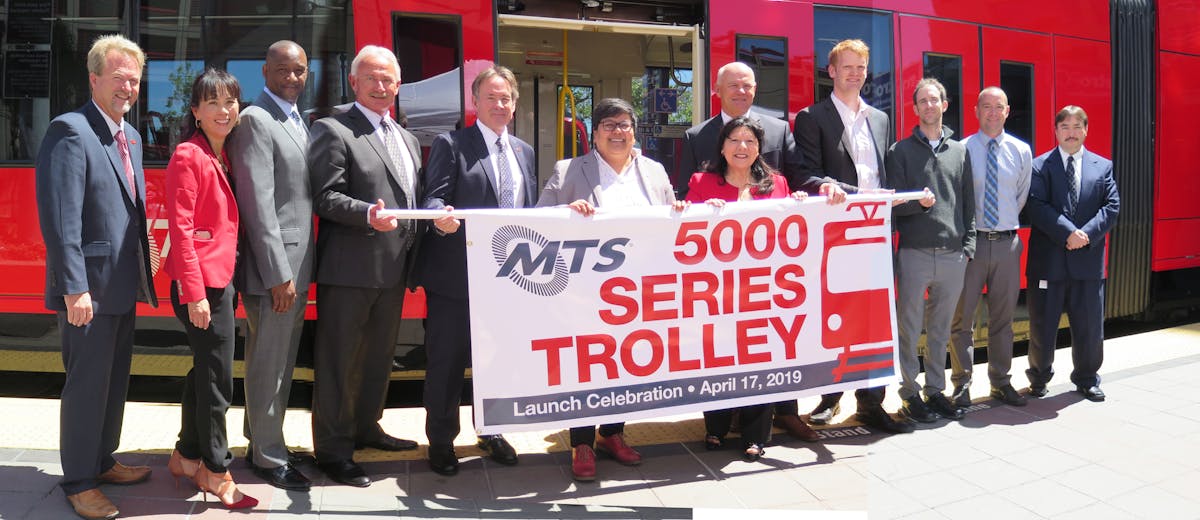 (From Left to Right) Mike Wygant, Chief Operating Officer, MTS Bus; Kim Kawada, Chief Deputy Executive Director, SANDAG; Brian Riley, Superintendent of Transportation, MTS Rail; Wayne Terry, Chief Operating Officer, MTS Rail; Paul Jablonski, Chief Executive Officer, MTS; Georgette G&oacute;mez, City of San Diego Council President and Board of Directors Chair, MTS; Mona Rios, Vice Chair, MTS; Robin Stimson, Vice President of Business Development, Siemens; Chuck Bell, Project Manager, Siemens; Nick Balfour, Engineering Project Manager, Siemens; Andy Goddard Jr., Superintendent of LRV Maintenance, MTS Rail; Ed Graham, Assistant Superintendent of Transportation, MTS Rail.