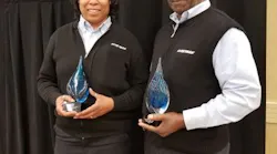 Raimey and Williams accepting their awards.
