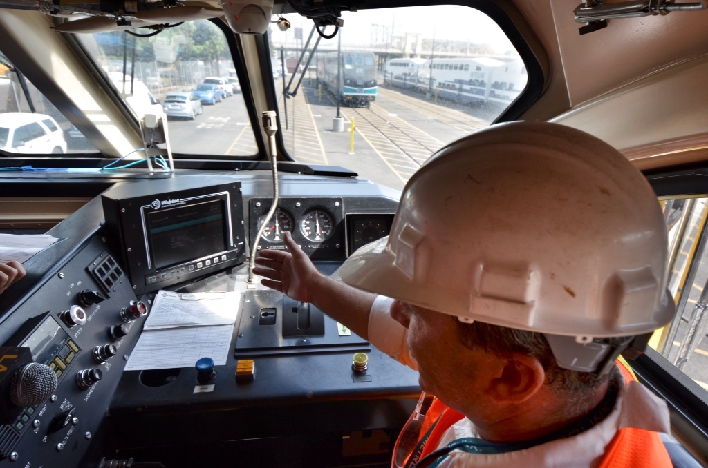 In this 2012 image, Metrolink's Neil Brown shows PTC technology in a locomotive.