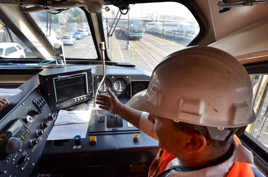 In this 2012 image, Metrolink&apos;s Neil Brown shows PTC technology in a locomotive.