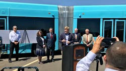 Officials debut the demo 60-foot articulated bus that will serve ART routes.