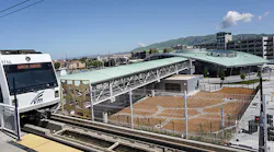 A Santa Clara VTA train travels past the newly constructed Milpitas Station, which is one of two new stations constructed as part of the first phase of the BART Silicon Valley Berryessa Extension.