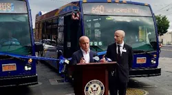 Matt Rose, at podium, and NYCT President Andy Byford at an event welcoming the new buses to Staten Island.