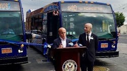 Matt Rose, at podium, and NYCT President Andy Byford at an event welcoming the new buses to Staten Island.