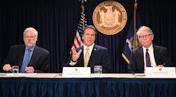 New York Gov. Andrew M. Cuomo, flanked by Pat Foye, Chairman and CEO of the MTA, left, and New York County District Attorney Cy Vance discusses the MTA&apos;s new subway and bus fare evasion enforcement policy in New York City on June 17, 2019.