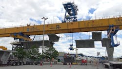 A launching gantry with several prefabricated concrete segments ready for assembly. A launching gantry with several prefabricated concrete segments ready for assembly.
