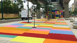 Wrapping around the new station house is 'Carpeting' by Renée Van Halm, a contemporary mosaic of brightly coloured geometric panels covering the pavement and walls. Wrapping around the new station house is 'Carpeting' by Renée Van Halm, a contemporary mosaic of brightly coloured geometric panels covering the pavement and walls.