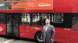 Paul stands by one of the iconic Red Transport for London public buses. Paul stands by one of the iconic Red Transport for London public buses.