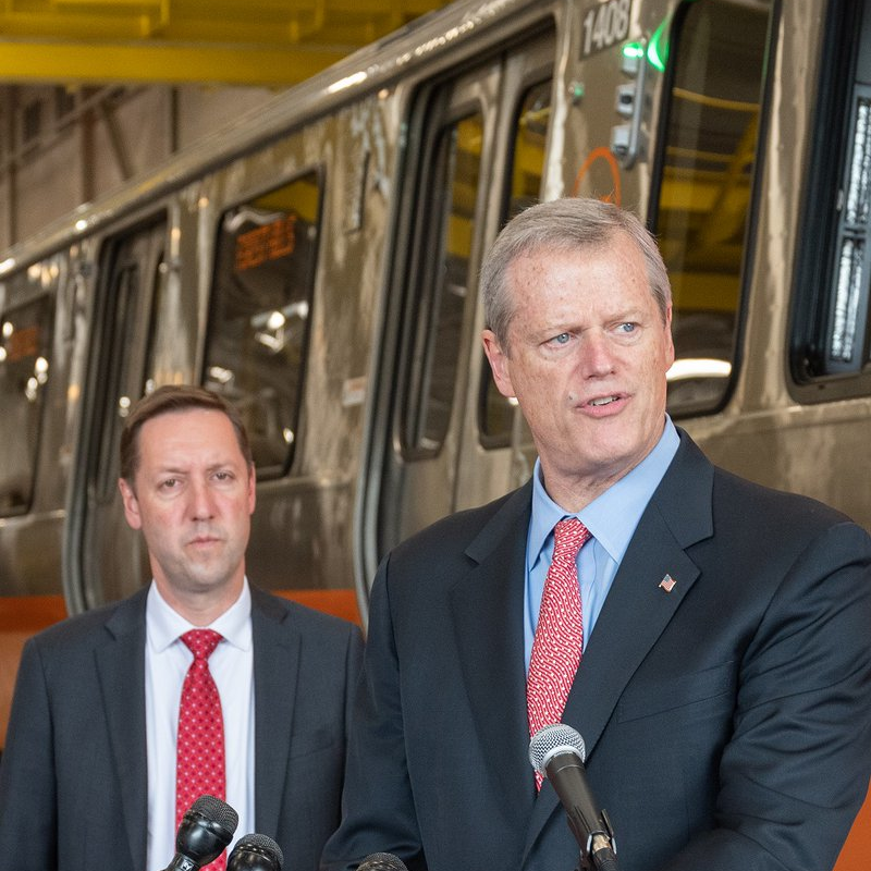 Gov. Charlie Baker outlines the plan to accelerate MBTA capital projects; MBTA General Manager Steve Poftak appears in the background.
