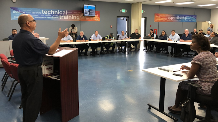 John Costa, at podium, international president of the Amalgamated Transit Union, speaks to participants of the Santa Clara VTA/ATU Joint Workforce program.
