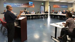 John Costa, at podium, international president of the Amalgamated Transit Union, speaks to participants of the Santa Clara VTA/ATU Joint Workforce program. John Costa, at podium, international president of the Amalgamated Transit Union, speaks to participants of the Santa Clara VTA/ATU Joint Workforce program.