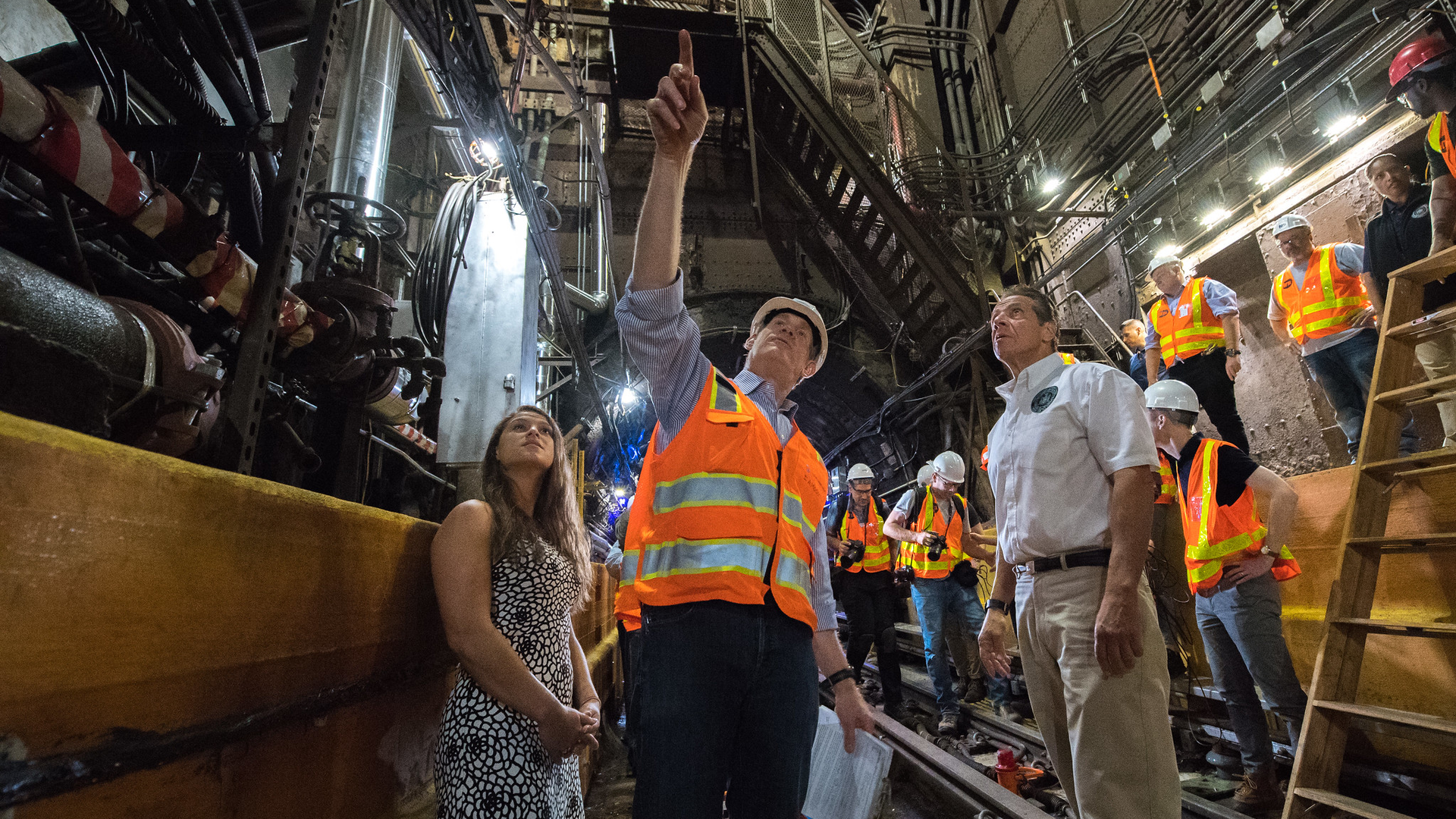 MTA's Janno Lieber points out work during a tour of the Canarsie Tunnels to New York Gov. Andrew Cuomo, right.