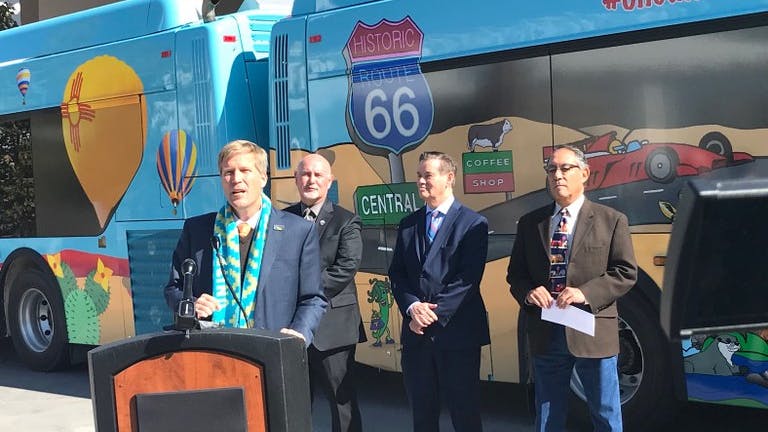 Mayor Tim Keller, Transit Director Danny Holcomb, City Councilor Ken Sanchez and Albuquerque Chief Operating Officer Lawrence Rael in front of what the mayor called some of the most colorful buses in the world.