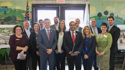 U.S. Reps. Sean Casten, in grey suit near the front center, and Raja Krishnamoorthi, in red tie near front center, joined village and regional officials to celebrate a grant to build a new commuter rail station. U.S. Reps. Sean Casten, in grey suit near the front center, and Raja Krishnamoorthi, in red tie near front center, joined village and regional officials to celebrate a grant to build a new commuter rail station.