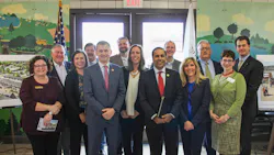 U.S. Reps. Sean Casten, in grey suit near the front center, and Raja Krishnamoorthi, in red tie near front center, joined village and regional officials to celebrate a grant to build a new commuter rail station. U.S. Reps. Sean Casten, in grey suit near the front center, and Raja Krishnamoorthi, in red tie near front center, joined village and regional officials to celebrate a grant to build a new commuter rail station.