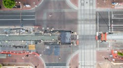 An aerial image shows the new construction streetcar track edging closer to the existing light-rail track. An aerial image shows the new construction streetcar track edging closer to the existing light-rail track.