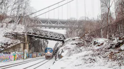 An Empire Service train passes under the George Washington Bridge in Manhattan.