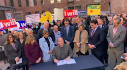 Gov. Polis signs his first executive order.