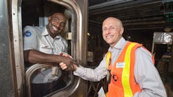 Byford, right, was well known for his ability to connect with and engage employees throughout the organization. He is shown shaking hands with Train Operator Cory Hodge, who operated the first train to stop at WTC Cortlandt subway station in September 2018.