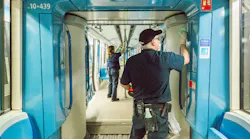 STM crews wipe down the interior of a train.