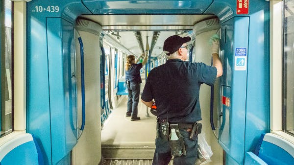 STM crews wipe down the interior of a train.