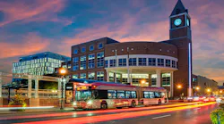A Zum bus travels in front of Brampton's City Hall.