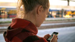 Daria Nepriakhina Unsplash Woman On Phone At Train Station