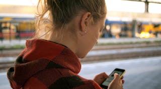 Daria Nepriakhina Unsplash Woman On Phone At Train Station