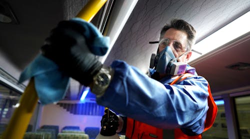 Wearing protective clothing due to the use of cleaning agents in a confined space, a Metrolinx crew member wipes down the inside of a GO bus in this March 2, 2020 image. Wearing protective clothing due to the use of cleaning agents in a confined space, a Metrolinx crew member wipes down the inside of a GO bus in this March 2, 2020 image.