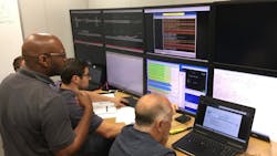 Engineers monitor performance of the communications between the train and the PTC system during a simulated train run in Metra’s PTC lab. Engineers monitor performance of the communications between the train and the PTC system during a simulated train run in Metra’s PTC lab.