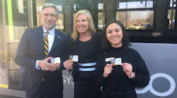 Wake Tech President Scott Ralls, interim GoTriangle CEO and President Shelley Blake Curran and Wake Tech Student Body President Nicole Castillo show off their GoPasses.