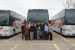 Holiday Tours team members celebrate the company's 100th Prevost coach purchase. Holiday Tours team members celebrate the company's 100th Prevost coach purchase.