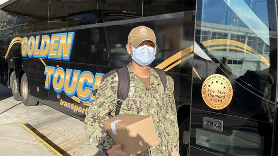 Golden Touch Transportation is transporting military personnel to the USNS Comfort.