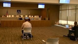 OCTA held its April 13 Board of Directors meeting via teleconference. Only the Board Chairman Steve Jones (center), CEO Darrell E. Johnson (right) and clerk Martha Ochoa (left) are at the dais, with less than 10 people in a room that holds 150. OCTA held its April 13 Board of Directors meeting via teleconference. Only the Board Chairman Steve Jones (center), CEO Darrell E. Johnson (right) and clerk Martha Ochoa (left) are at the dais, with less than 10 people in a room that holds 150.