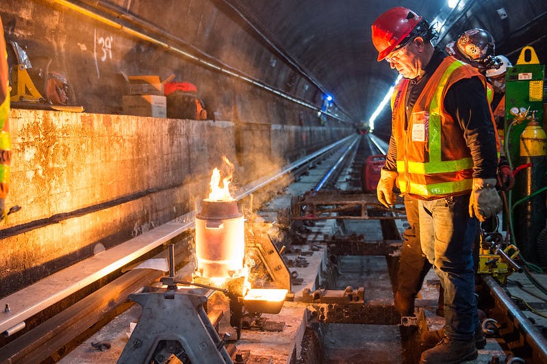 A thermite weld joining two pieces track together in this October 2019 image of work being performed as part of the L Project&apos;s tunnel rehabilitation.