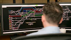 An Amtrak train director in Chicago directs trains at Union Station keeping the trains on schedule and making sure everything is safe. An Amtrak train director in Chicago directs trains at Union Station keeping the trains on schedule and making sure everything is safe.