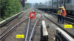This photo illustration depicts the accident scene on June 11, 2017.The photo was taken at track level from the east end of the Queens Village Station. The point where the roadway worker was struck by the train is marked with the red circle.