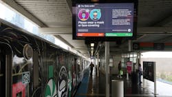 A CTA public service notification about wearing face coverings is displayed at the Roosevelt station, May 14, 2020.
