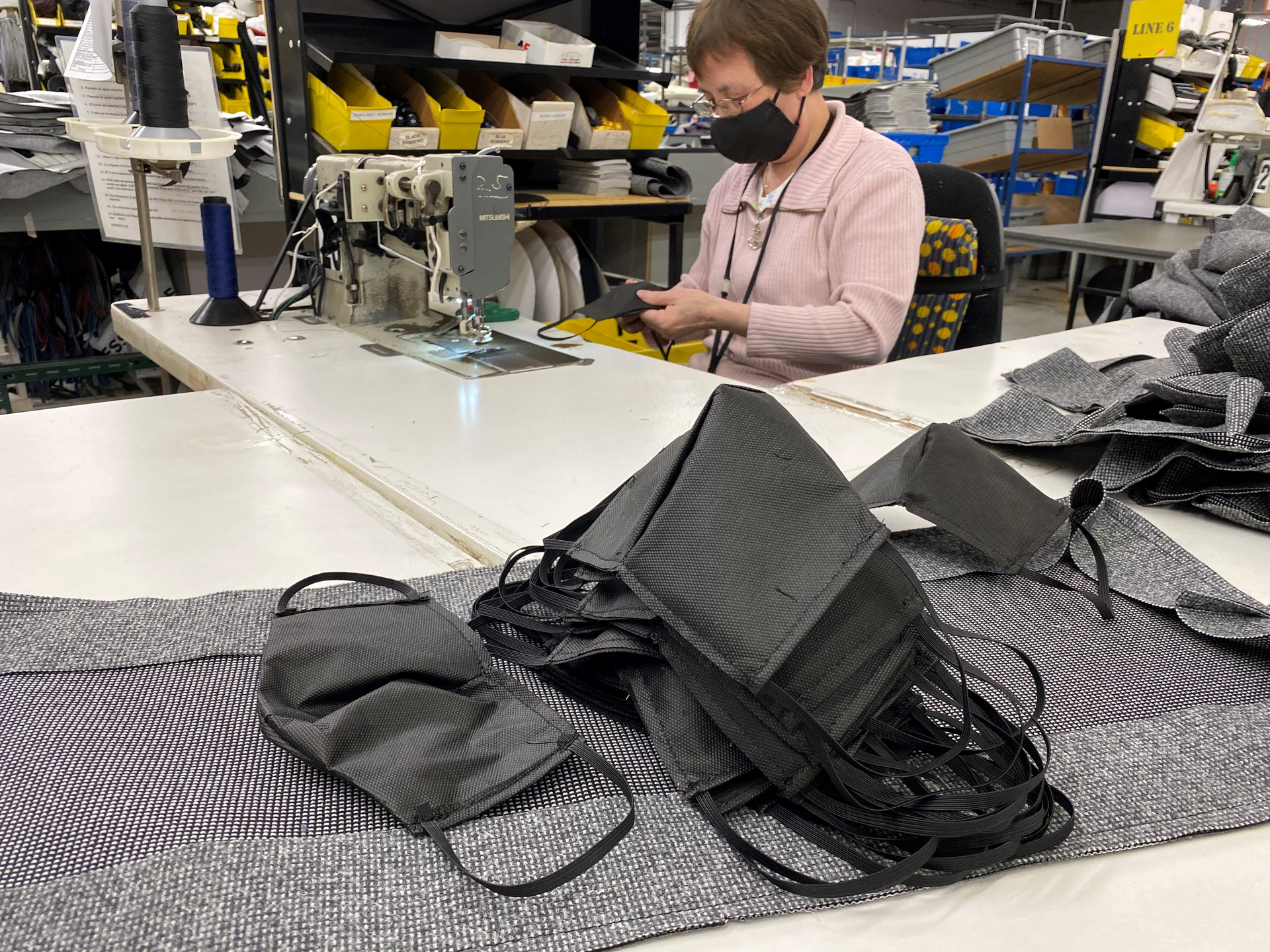 A mask is sewn at Freedman Seating. The company started producing masks for employees when PPE supplies were being reserved for essential workers.