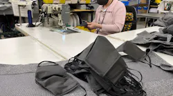 A mask is sewn at Freedman Seating. The company started producing masks for employees when PPE supplies were being reserved for essential workers.