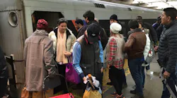 NJ Transit riders wait to board a train in Newark Penn Station. Regular rail service returns on July 6.