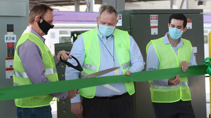 Officials cut the official ribbon celebrating the activation of the solar panels.