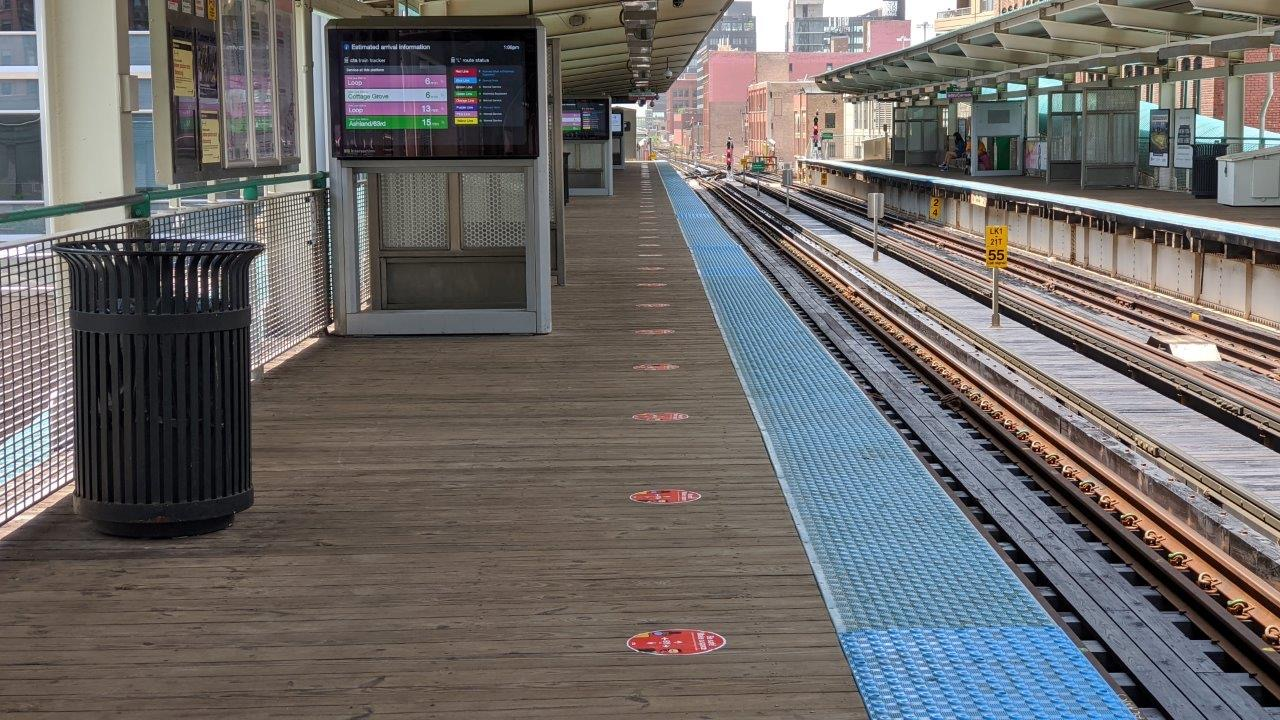 The decals, spaced six feet apart, serve as guides for how far apart customers should stand to ensure proper social distancing.