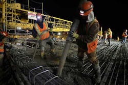 Met Council Workers pour concrete on the bridge where the Lake Street Station of the Orange Line will be built. Met Council Workers pour concrete on the bridge where the Lake Street Station of the Orange Line will be built.