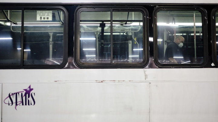 Mechanic Jeremy Strobel disinfects the interior of a bus at the STARS garage on Tuesday, March 17, 2020 in Saginaw, Mich. In the wake of a coronavirus outbreak, STARS has implemented new protocols for cleaning and riding their buses.