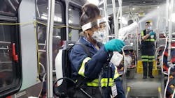 Denver RTD team members disinfect a bus using the EvaClean Protexus Backpack.