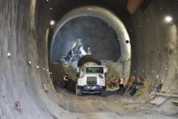 East portal: Tunnel One has surpassed the 50 per cent excavation mark. Shotcrete is applied using robotic technology fed by a cement truck.