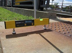 Digital leveler shows the slope of an access approaching the 38th Street light-rail station violates ADA standards.
